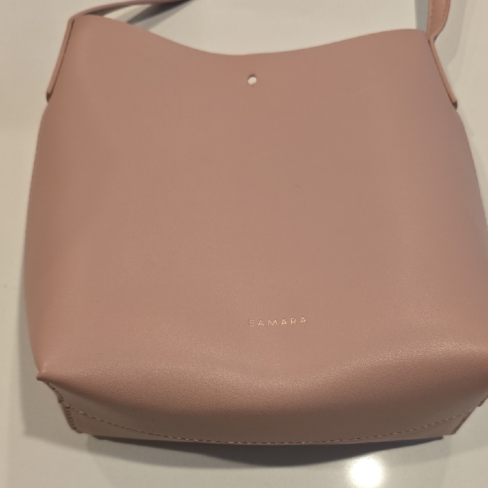 Elegant Pink Shoulder Bag with Curved Design